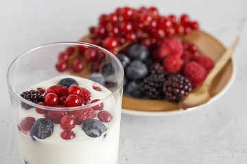 Yogurt with berries, cranberries and raspberries