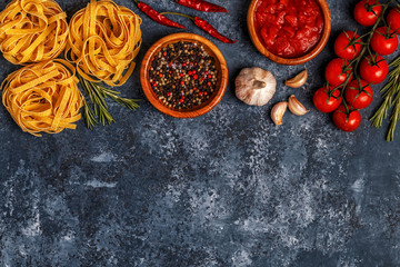 Italian food background with pasta, spices and vegetables.