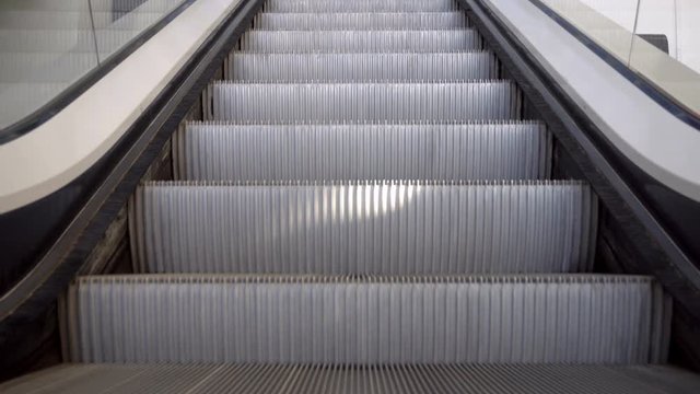 Up and down escalators in public building. Indoors