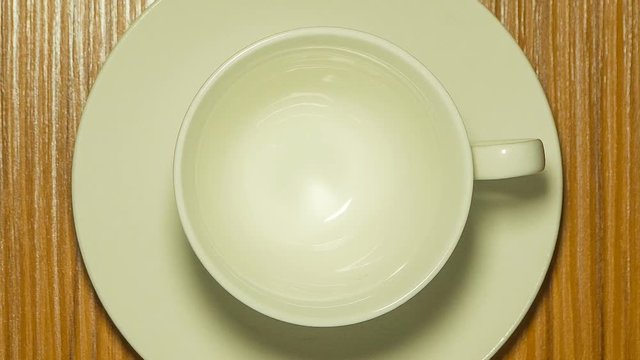 white coffee  cup on wood table top view