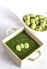 Green vegetable cream soup with peas and beans