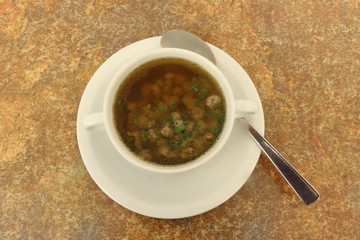 Liver spaetzle soup is a typical bavarian soup with small pieces of pork liver, Leberspätzlesuppe
