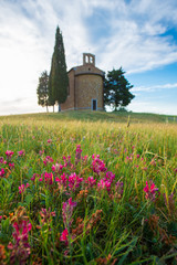 Tuscany landscape with a little chapel of Madonna di Vitaleta, San Quirico d'Orcia, Italy