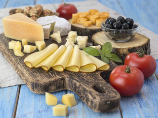 Cheese on a wooden board. 