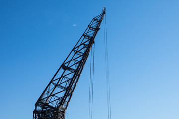 Vintage crane hook with blue sky backgrounds