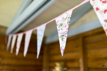 Floral bunting hanging from an English summer house