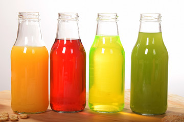 fruit juice in glass bottles with empty space for text