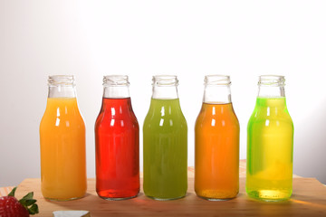 fruit juice in glass bottles with empty space for text