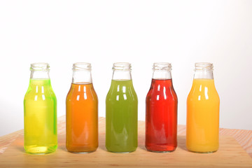 fruit juice in glass bottles with empty space for text