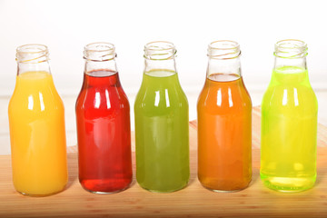 fruit juice in glass bottles with empty space for text