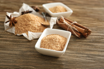 Beautiful composition with cinnamon sugar on wooden background