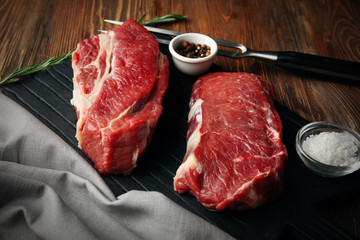 Fresh raw meat on wooden board
