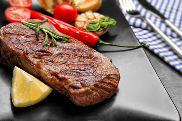 Tasty grilled steak on plate