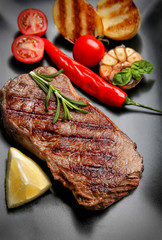 Tasty grilled steak on plate