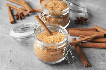 Beautiful composition with sweet cinnamon sugar on table