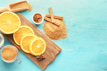 Composition with pile of sweet cinnamon sugar on color wooden table