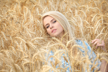 Attractive young woman in wheat field