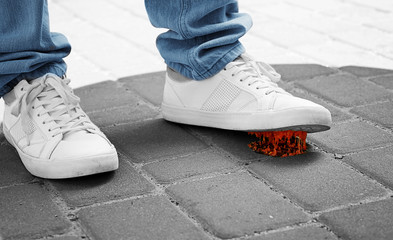 Man and chewing gum on sidewalk. Concept of stickiness