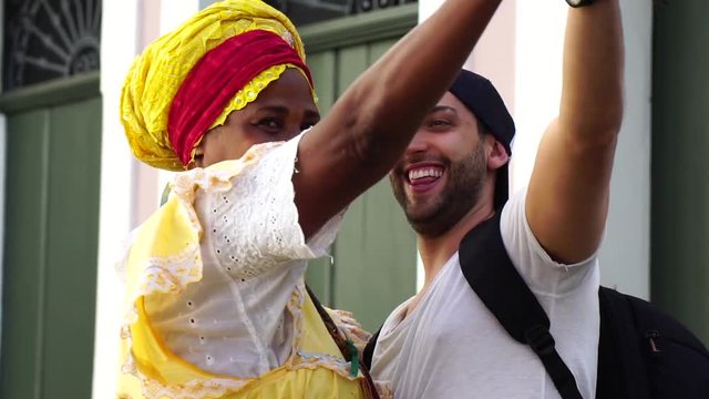 Traveler dancing with Brazilian Woman - Baiana, Brazil
