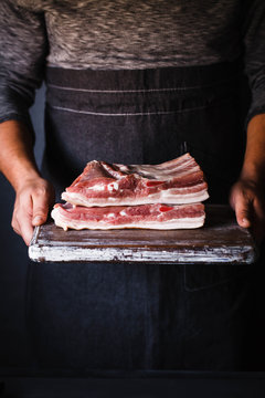 Pork belly Farm fresh Pork Belly butcher person curring bacon porchetta