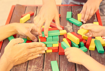 Fototapeta premium family collects colored cubes for the game