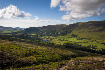 Beautiful valley in the Scottish Highlands with a river and lakes; Concept for travel in Scotland and United Kingdom