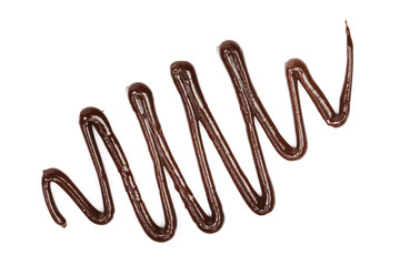 Hot melted chocolate pouring isolated on white background, top view