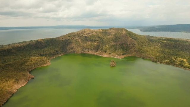 Aerial view Lake crater at Taal Volcano on Luzon Island North of Manila in Philippines. Volcano with a crater on an island in the middle of a lake. Luzon, Philippines. 4K video. Travel concept. Aerial