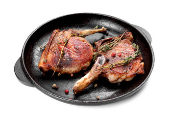 Frying pan with grilled meat on white background