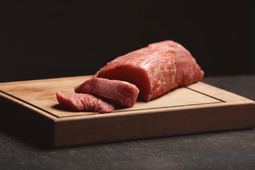 Fresh raw meat on wooden board