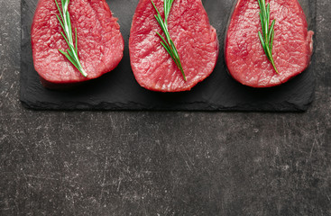Fresh raw meat on slate plate