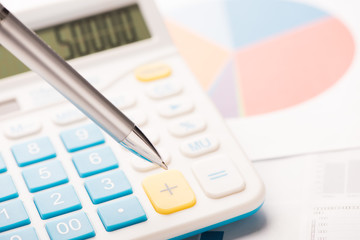 Financial statements. Business Graph. Focus on pen.