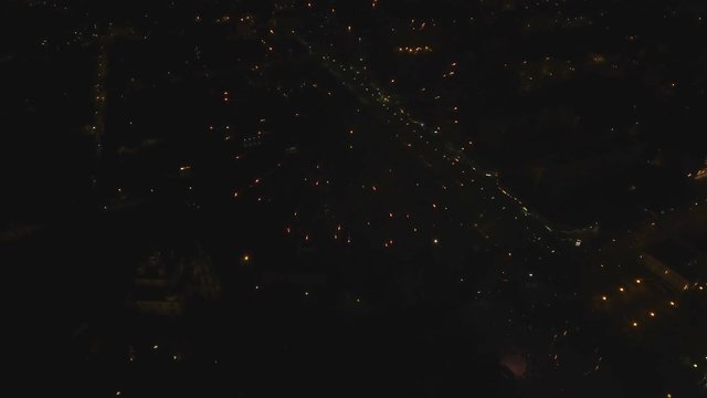 Aerial view Beautiful fireworks video from the drone in the night sky on celebration. Sparks. Fireworks are a class of explosive pyrotechnic devices used for aesthetic and entertainment purposes