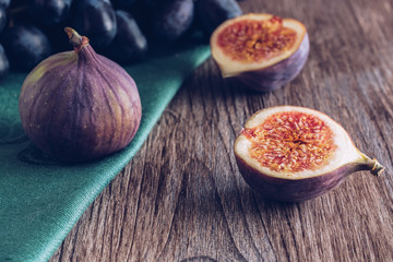Figs on a wooden dark table. Still life with figs. Selective focus
