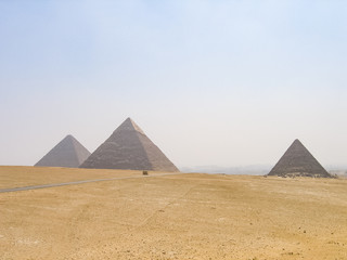 Fototapeta na wymiar Three pyramids in Giza with road landscape