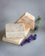 Handmade soap with lavender on a gray background.