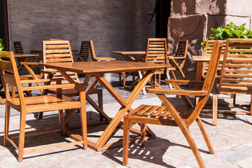 wooden furniture on the veranda of the hotel