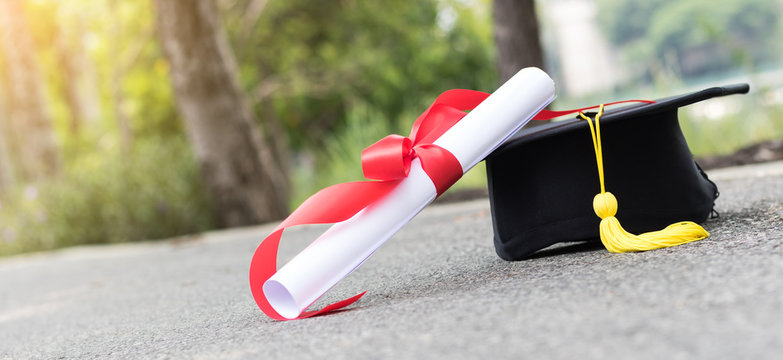 graduate hat and certificated on street