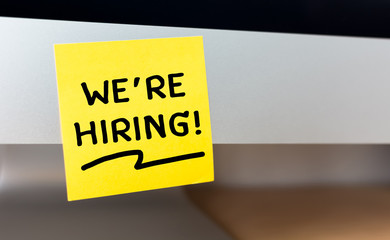 we are hiring message on sticky note, Human resource management and recruitment business concept