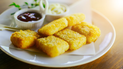 Chicken nuggets on plate.