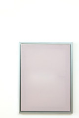 blank frame on a white wall background.