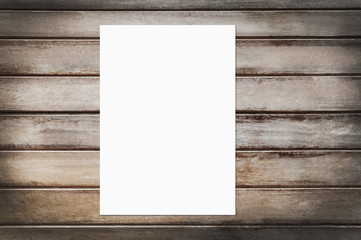 White mockup paper poster is on the wood background.