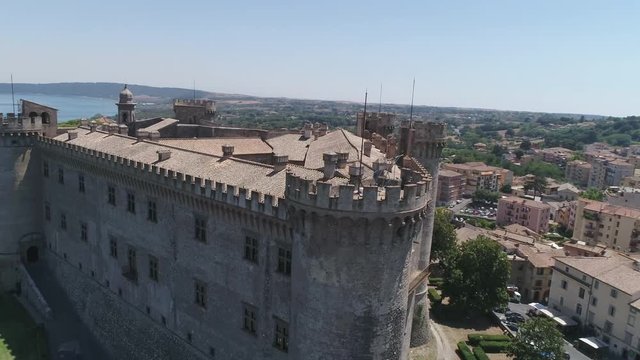 Watchtower of the castle Orsini - Odescalchi castle in the middle consideration. Magnificent lake Bracciano.