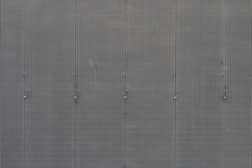 Grey texture with vertical lines.