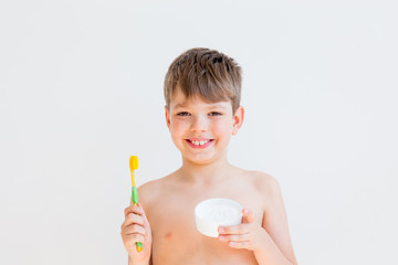 Boy is brushing teeth