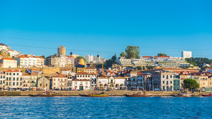 Fototapeta na wymiar Porto, Portugal, panorama of the river Douro and the quays with wine cellars and the cable railway 