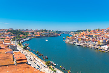 Naklejka na ściany i meble Porto, Portugal, panorama of the river Douro and tiles roofs 