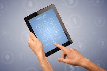 Female hand holding tablet