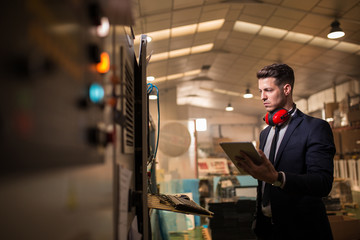Formal man controlling factory