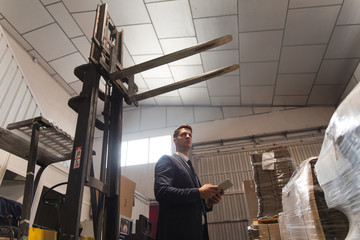 Formal man controlling factory